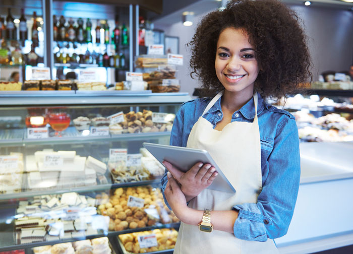 young african american woman working in a bake shop